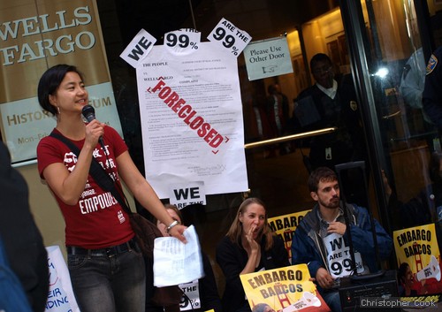 In concert with the growing Occupy Wall Street movement, Shaw-San Liu of the Chinese Progressive Association addresses demonstrators outside Wells Fargo Bank in San Francisco. Photos by Christopher Cook.