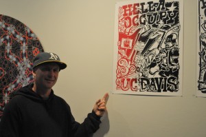 Artist Jon-Paul Bail shows his Hella Occupy poster at the Occupy Bay Area art show on July 14, 2012 at the Yerba Buena Center for the Arts in San Francisco. Photo by Shane Menez
