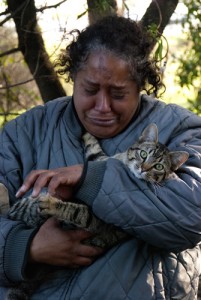 Irma Garcia holds her cat "Joey" on Tuesday (Feb.14) in South San Francisco and begins to cry as she mentions how the raccoons living around her campsite are constantly attacking her cat. She says that she worries they will hurt Joey in the near future.