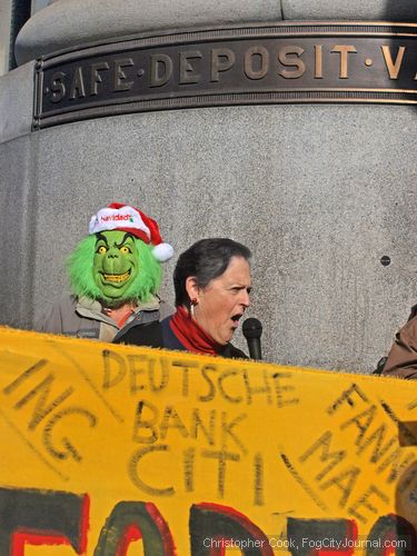 San Francisco Democratic County Central Committee member Hene Kelly speaks to a crowd of protesters urging  Wells Fargo Bank in San Francisco to stop evicting seniors. Photo by Christopher Cook.