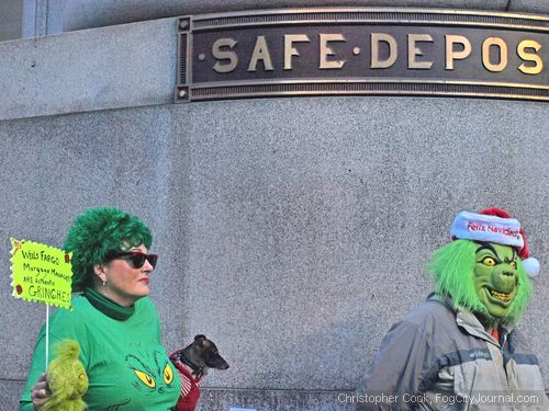 Grinch-clad protesters. Photo by Christopher Cook.