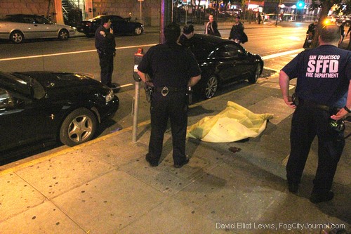 A Latino man, aged 24, lies dead on the streets of San Francisco following a gangland-style shootout in the Tenderloin, 7/20/13.  Photo by David Elliot Lewis.