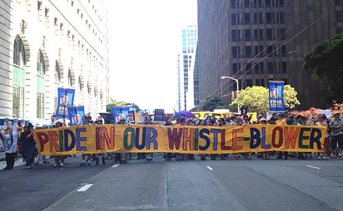 Beadley Manning supporters held a sign hat read, "Pride in our whistleblower."