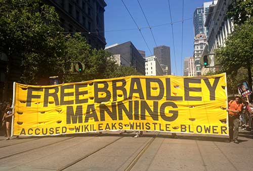 Supporters held a large banner that read "Free Bradley Manning - Accused WikiLeaks whistleblower."