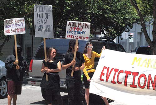 Tenants and supporters rally in front of landlord Rick Holman's South Park office.`
