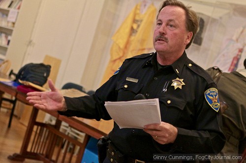 SFPD Lt. Bruce Delahunty addressed concerns raised by District 5 residents convened at the Korean American Community Center on Monday over a recent uptick in violent crimes.  Photos by Ginny Cummings.